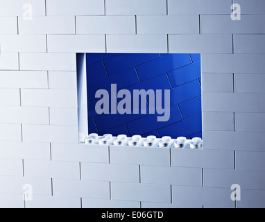 a blue and white lego wall and window Stock Photo