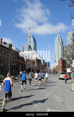 Toronto, Canada. 04th May, 2014. Runners head toward downtown, Goodlife Fitness Toronto Marathon, Front Street, Toronto , Ontario, Canada - 4 May 2014  Credit:  Peter Llewellyn/Alamy Live News Stock Photo