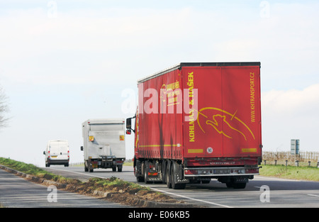 Trucks traveling on the A417 dual carriageway in the Cotswolds, England Stock Photo