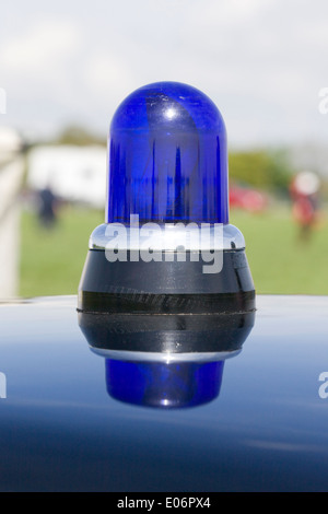 Blue police light on old classic Police car Stock Photo