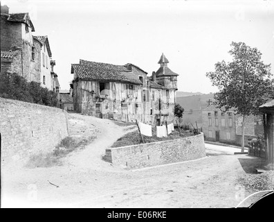 This photograph taken on June 5, 1906, shows an old dovecote in Caylus, capturing the rural and historical charm of the building. The structure is a key feature of rural French architecture, often used for keeping pigeons. Stock Photo