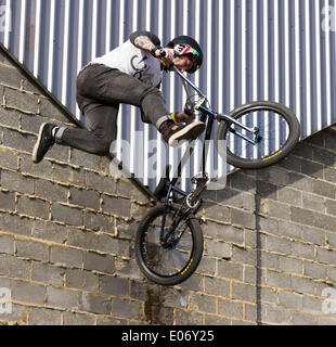 London, UK. 5th May 2014. BMX riders performing at the London Streetfest on Sunday, 4 May, 2014 in Hackney Wick’s Fish Island, London, UK. The Streetfest is a urban culture festival taking place in East London where are represented several forms of street art: DJ-sets, rap, breakdance, skateboarding, BMX riding and graffiti performances. Credit:  Cecilia Colussi/Alamy Live News Stock Photo