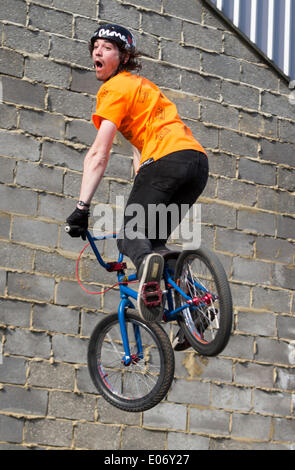 London, UK. 5th May 2014. BMX riders performing at the London Streetfest on Sunday, 4 May, 2014 in Hackney Wick’s Fish Island, London, UK. The Streetfest is a urban culture festival taking place in East London where are represented several forms of street art: DJ-sets, rap, breakdance, skateboarding, BMX riding and graffiti performances. Credit:  Cecilia Colussi/Alamy Live News Stock Photo