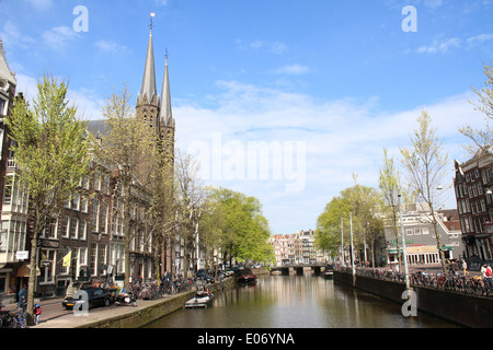 Singel canal in Amsterdam with the prominent late 19th century Krijtberg church, a.k.a. Sint-Franciscus Xaveriuskerk Stock Photo