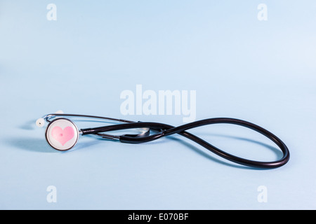 a black stethoscope with a heart shape on it