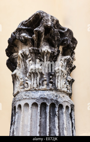 an ancient classical column ruined by time and weather Stock Photo