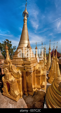 Golden stupas of Shwe Indein Pagoda over blue sky. Indein village, Inle Lake, Shan State, Myanmar (Burma) Stock Photo