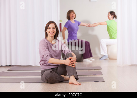 Three women have fun on Pilates class Stock Photo