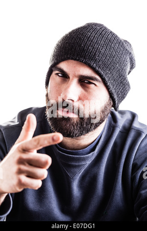 a man with a beanie and a beard pointing at you isolated over white Stock Photo