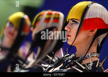 Frankfurt Main, Germany. 05th May, 2014. Models present hairstyles in the 'Progressive cut & style model' category of the women's competition of the world hairdressing championships at Festhalle in Frankfurt Main, Germany, 05 May 2014. More than 1,000 participants from 50 countries will compete in the championship. Photo: ARNE DEDERT/DPA/Alamy Live News Stock Photo