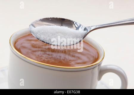 White Granulated Sugar In A White Cup On A Pile Of Sugar Stock Photo Alamy