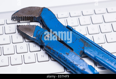 old wrench on a keyboard Stock Photo