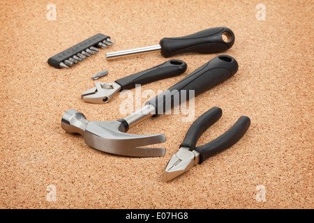 Set of tools on cork panel background Stock Photo