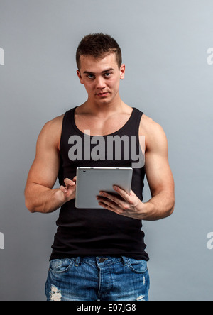 Young man using tablet computer Stock Photo