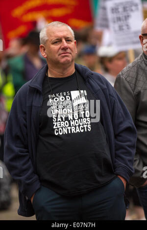 Salford, Manchester, UK  5th May, 2014. 'No to Zero hours contracts' T-Shirt at Salford's annual May Day Rally.  Manchester, Salford, Bury and Oldham Trades Union Councils organized this year’s May Day event in Manchester, with the message `A Better Future for All Our Communities' to celebrate international workers day. Workers gathered at Bexley Square to hear speakers prior to marching to Cathedral Gardens. The themes this year included opposition to cuts, the Bedroom Tax and fracking. Credit:  Mar Photographics/Alamy Live News Stock Photo