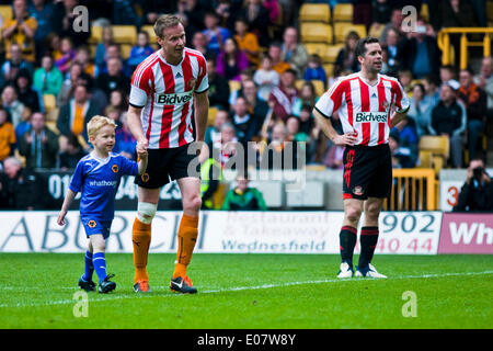 Wolverhampton, UK. 5th May, 2014.  Jody Craddock brings his son on to the pitch to take a penalty in his testimonial against the ex players of his former club Sunderland, raising money for the Birmingham Children's Hospital. Credit:  Paul Swinney/Alamy Live News Stock Photo