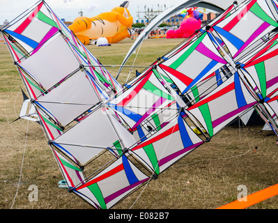 A box kite sits on the ground at the Southsea Kite festival Stock Photo