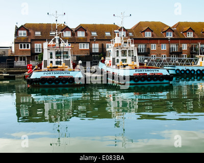 Blue tugs belonging to J Butcher and sons docked in Camber Wharf, Old Portsmouth, Hampshire Stock Photo
