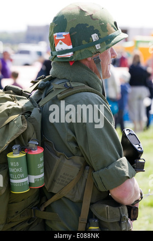 soldier on guard duty with a packet of marlboro cigarettes and smoke bombs Stock Photo