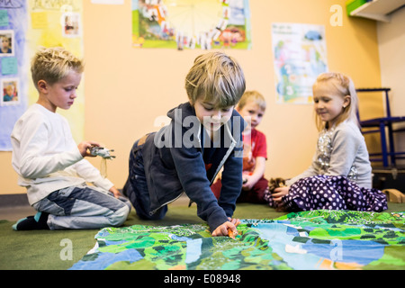 Elementary students playing in kindergarten Stock Photo