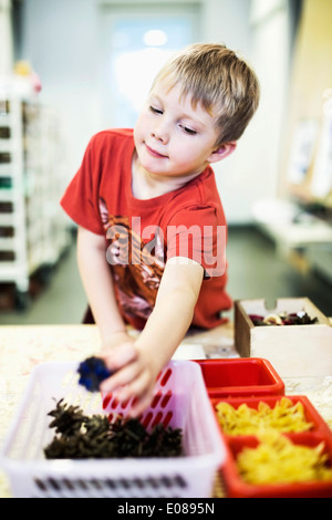 Little boy in art class at kindergarten Stock Photo