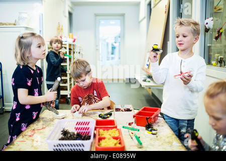 Elementary students in art class at kindergarten Stock Photo