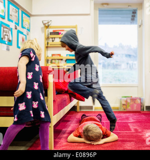 Kids playing in kindergarten Stock Photo