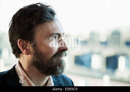Thoughtful businessman looking away outdoors Stock Photo