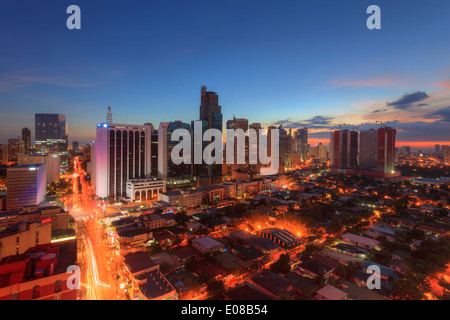 Philippines, Manila, Makati Business District, Makati Avenue and City Skyline Stock Photo