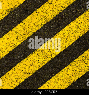 Yellow and black striped caution traffic sign Stock Photo - Alamy