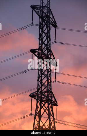 Red clouds at sunset behind power pylon, Belmont Regional Park, Wellington, New Zealand Stock Photo