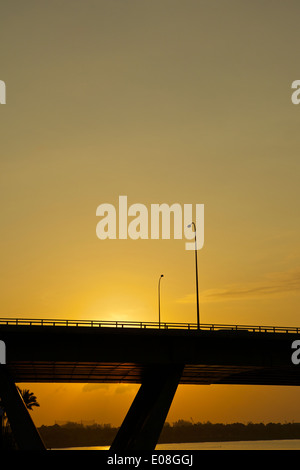 Sunrise behind the ECP Bridge over Marina Bay, Singapore Stock Photo