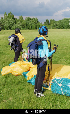 One day with parachutist in airfield. After landing. Stock Photo