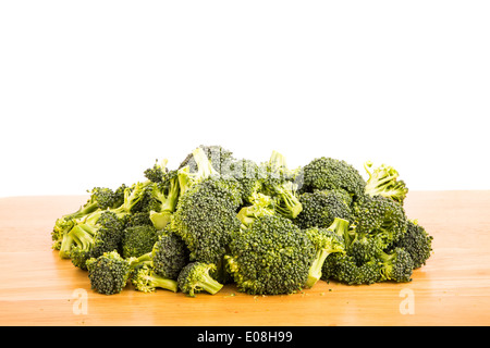 Fresh broccoli on a wood table with a white background Stock Photo