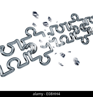 Broken chain puzzle business concept as metal links shaped as jigsaw puzzle pieces breaking apart exploding shards of chrome as Stock Photo