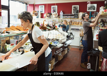 Male and female worker working in supermarket Stock Photo