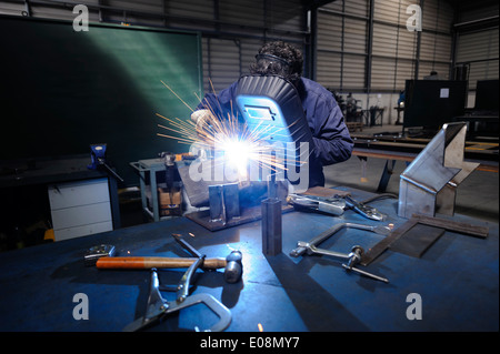 Man welding with safety mask Stock Photo