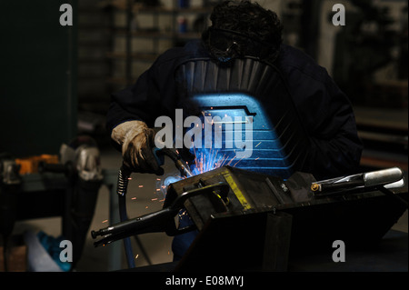 Man welding with safety mask Stock Photo