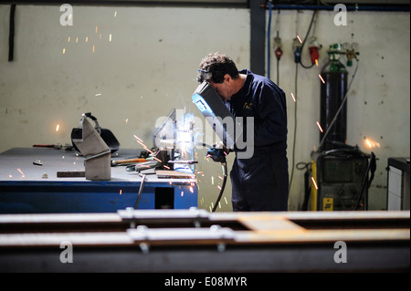 Man welding with safety mask Stock Photo