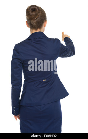 Business woman pointing. rear view Stock Photo