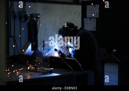 Man welding with safety mask Stock Photo