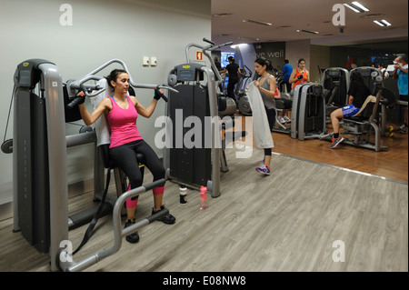 Young woman working out at the gym Stock Photo