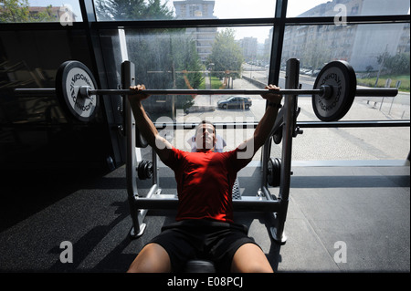 Man lifting weights at the gym Stock Photo