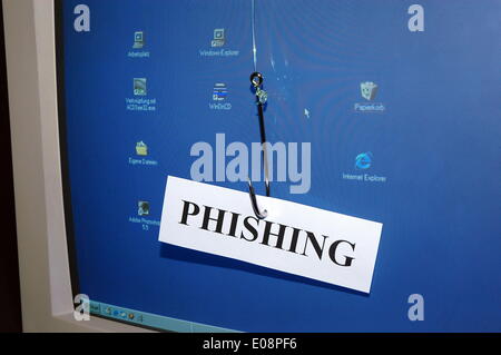 Illustration - A sign reading 'Phishing' hangs on a fish hook in front of a computer screen in Germany, 30 December 2006. Fotoarchiv für ZeitgeschichteS. Steinach - NO WIRE SERVICE Stock Photo