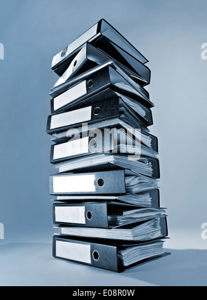 A tall stack of ring binders. Stock Photo