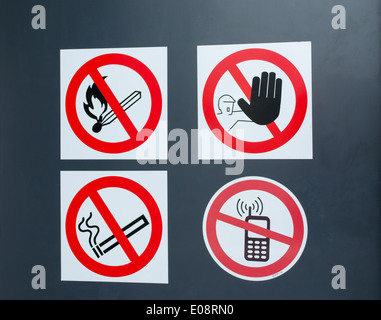 Special fire warning signs symbol on gas factory door. High explosion risk zone. Stock Photo