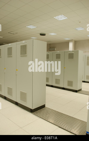 Powerful servers computers placed in special cabinets stored in scientific research center. Stock Photo