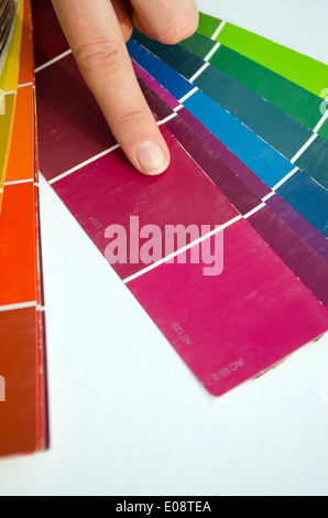 woman finger and purple shades color palette guide Stock Photo