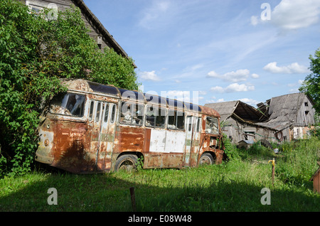 rusty lonely broken mini bus in country green field Stock Photo