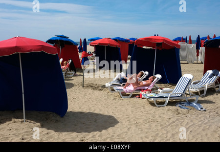 Sunbathing on the beach in Cannes on the French Riviera 